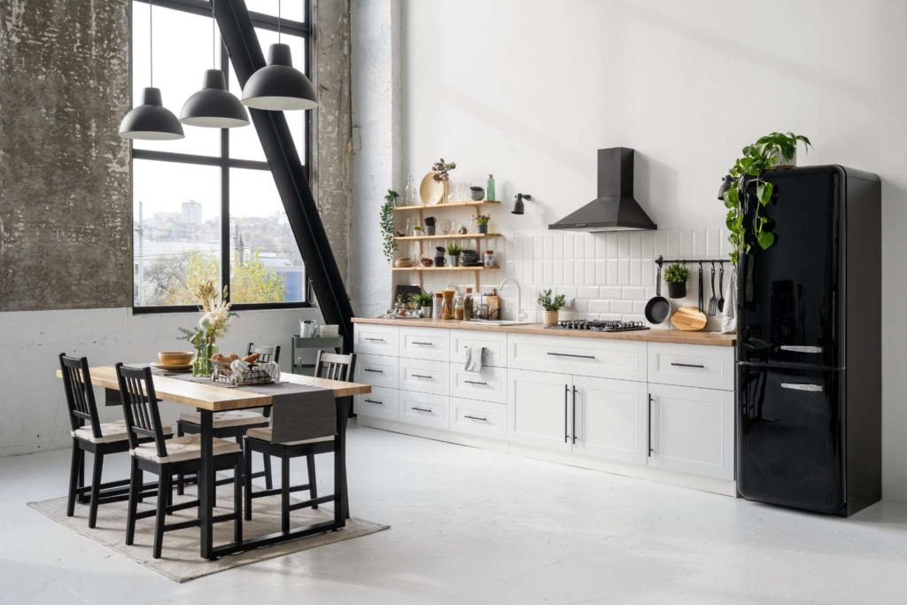 White kitchen with black furniture and appliances