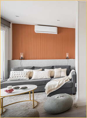 Bright living room with wood accent wall and large windows